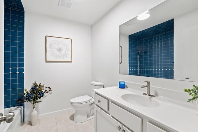 full bathroom featuring baseboards, visible vents, toilet, tile patterned floors, and vanity