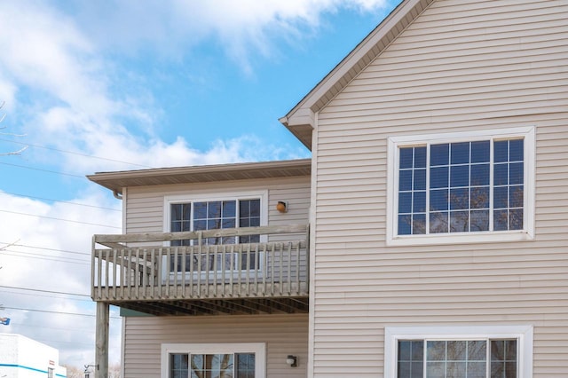 view of side of home with a balcony