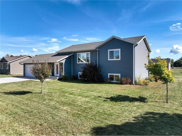 split level home featuring driveway, a front lawn, and an attached garage