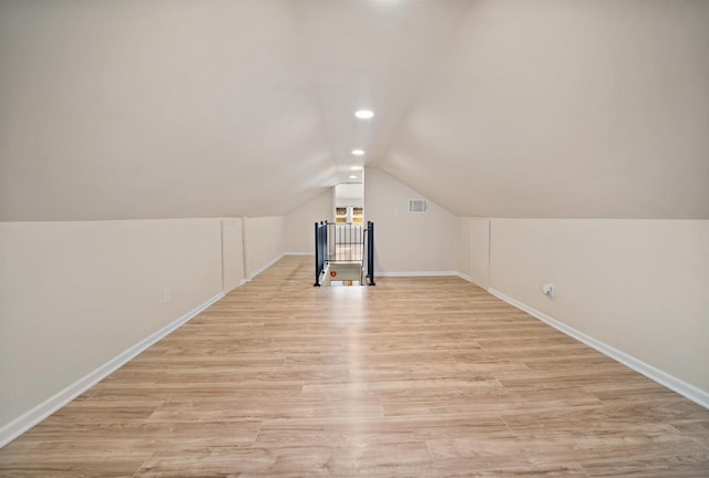 N8648 Linden Beach Rd, Fond Du Lac, WI 54937 - bonus room with lofted ceiling, baseboards, light wood-style floors, and recessed lighting