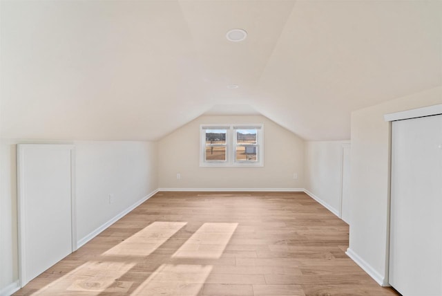 N8648 Linden Beach Rd, Fond Du Lac, WI 54937 - bonus room featuring light wood-type flooring, baseboards, and vaulted ceiling