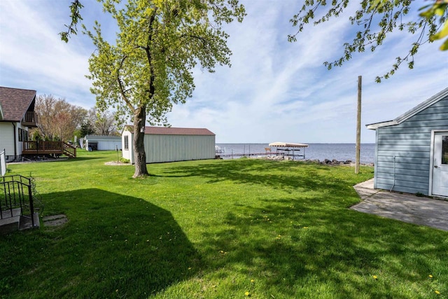 N8648 Linden Beach Rd, Fond Du Lac, WI 54937 - view of grassy yard featuring a water view and an outbuilding