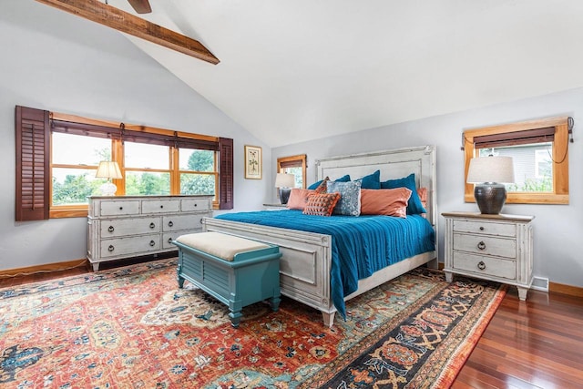 bedroom featuring a ceiling fan, lofted ceiling with beams, baseboards, and wood finished floors