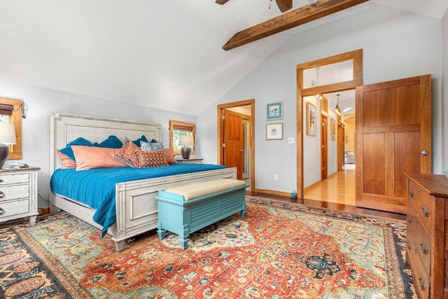 bedroom featuring lofted ceiling with beams, ceiling fan, wood finished floors, and baseboards