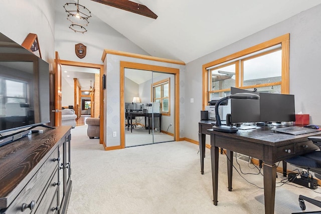 office space featuring vaulted ceiling with beams, plenty of natural light, and light colored carpet