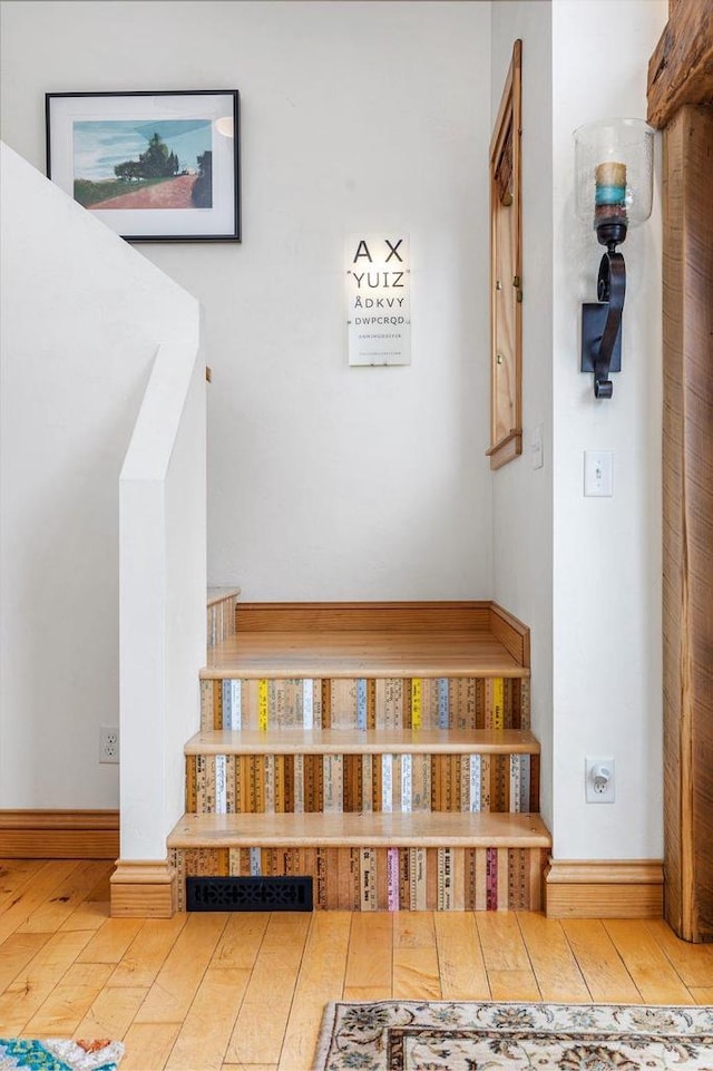 interior space featuring wood finished floors and baseboards