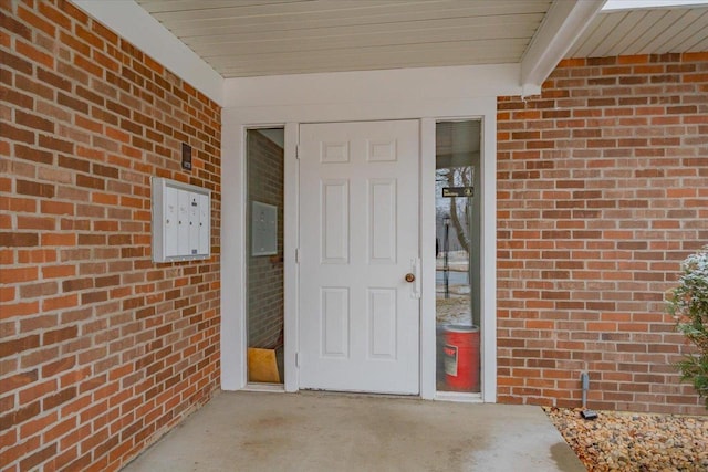 entrance to property with brick siding