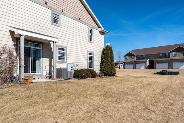 exterior space featuring a yard and central AC unit