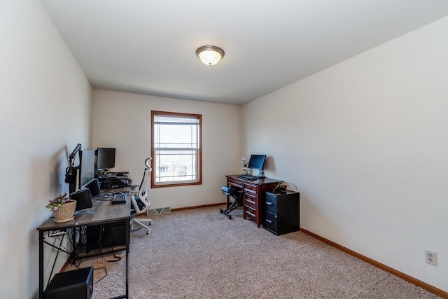 office area featuring visible vents, carpet floors, and baseboards