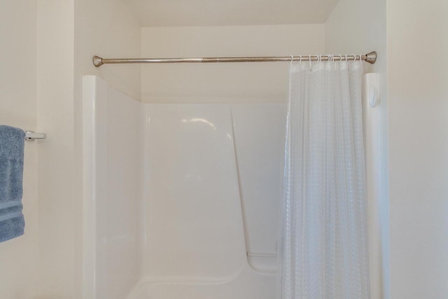 bathroom with a shower with shower curtain