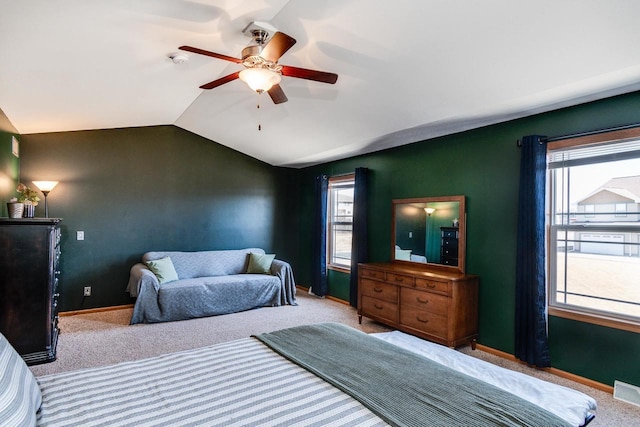 bedroom featuring baseboards, lofted ceiling, carpet, and a ceiling fan