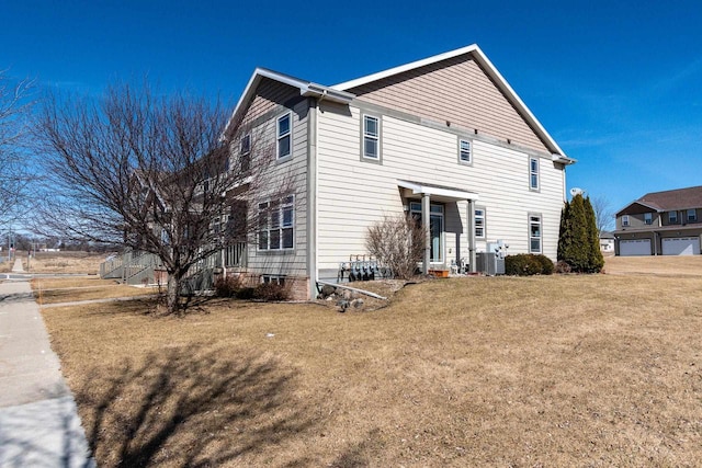 back of house featuring a yard