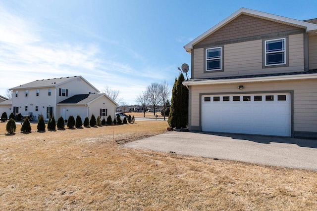 exterior space with an attached garage and driveway