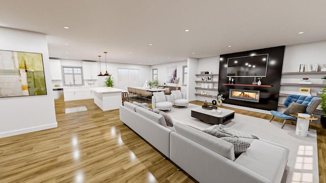 living area featuring baseboards, recessed lighting, a multi sided fireplace, and light wood-style floors