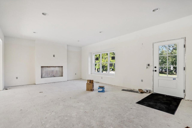 unfurnished living room featuring a fireplace