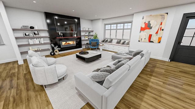 living area featuring recessed lighting, baseboards, wood finished floors, and a multi sided fireplace