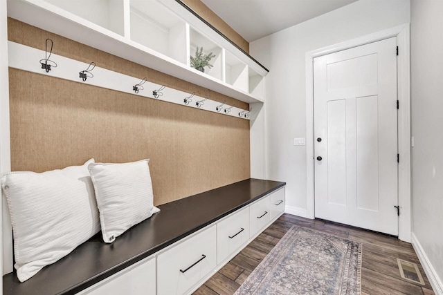 mudroom featuring dark wood-style floors, visible vents, and baseboards