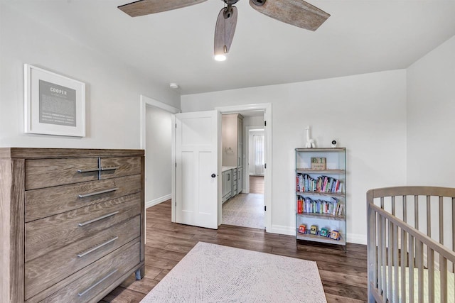 bedroom with dark wood finished floors and baseboards