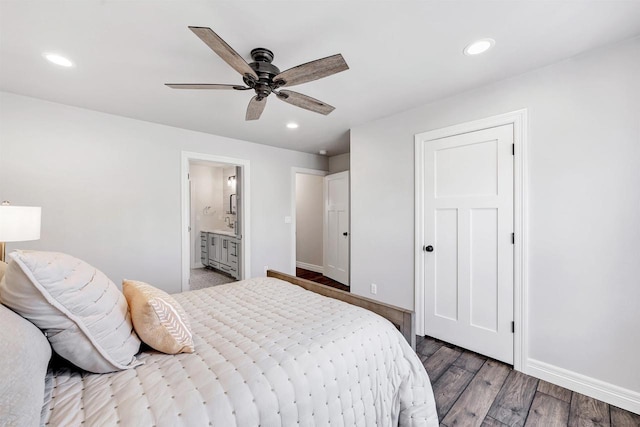 bedroom featuring connected bathroom, baseboards, wood finished floors, and recessed lighting