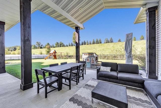 view of patio / terrace with a playground, outdoor dining area, outdoor lounge area, and a fenced backyard