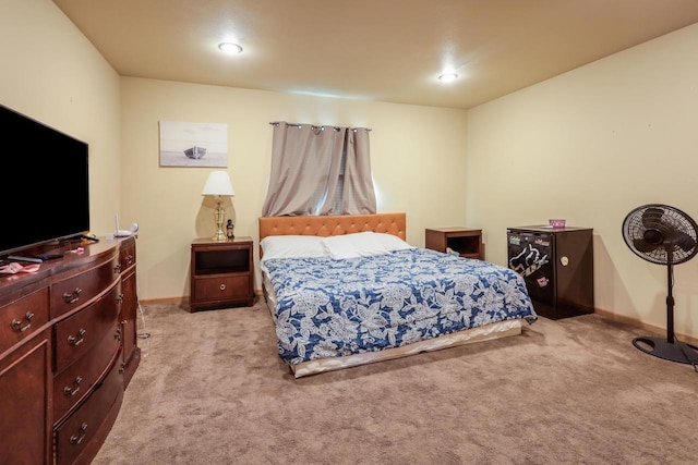 carpeted bedroom featuring recessed lighting and baseboards