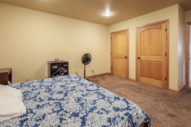 carpeted bedroom with baseboards