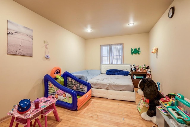 bedroom with wood finished floors