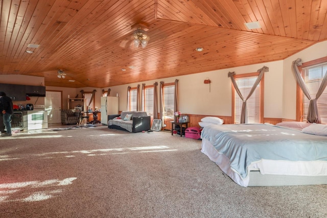 bedroom featuring carpet floors, freestanding refrigerator, wooden ceiling, and lofted ceiling