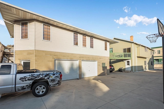 exterior space featuring driveway and a garage