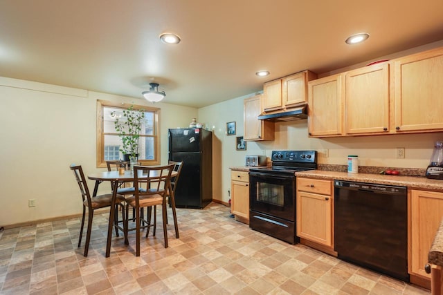 kitchen featuring black appliances, light brown cabinetry, and under cabinet range hood