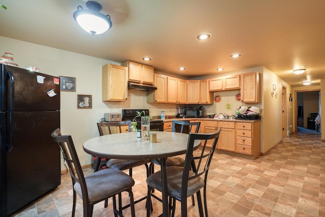 kitchen featuring black appliances, light brown cabinetry, recessed lighting, and under cabinet range hood