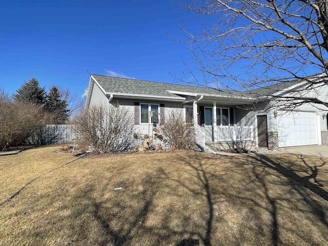 ranch-style house featuring concrete driveway, an attached garage, covered porch, a front yard, and brick siding