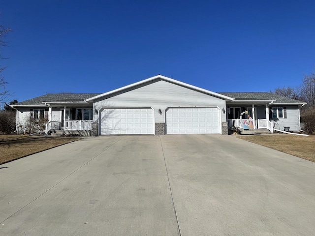 single story home with a garage, covered porch, concrete driveway, and brick siding