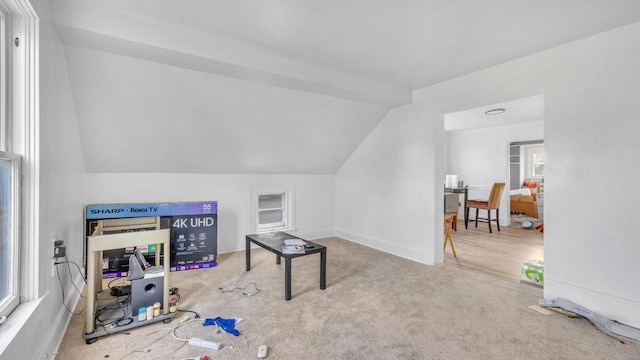 rec room featuring carpet and lofted ceiling