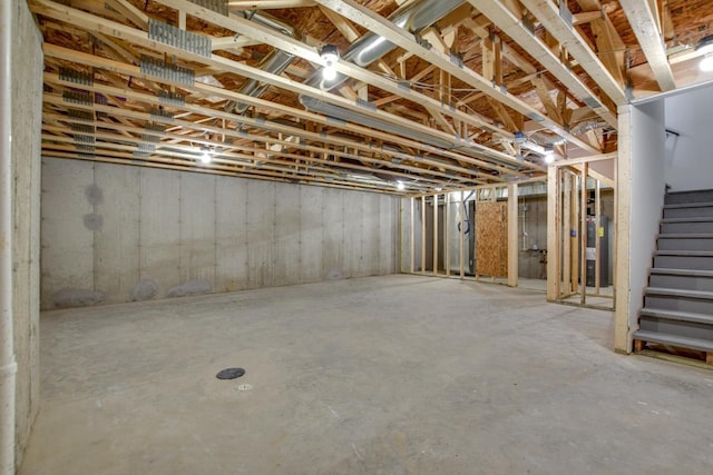 unfinished basement featuring stairs