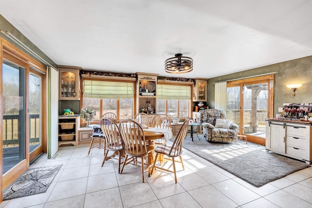 dining area featuring light tile patterned floors