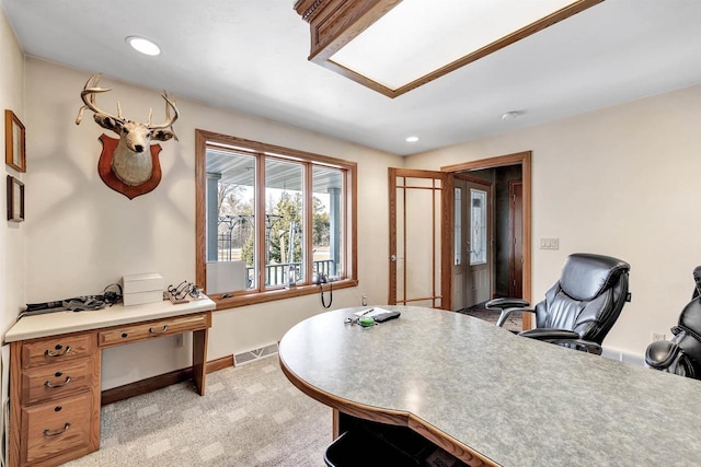 office area featuring light carpet, recessed lighting, visible vents, and baseboards