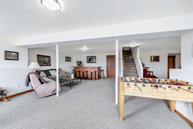 playroom featuring carpet floors, a dry bar, and baseboards