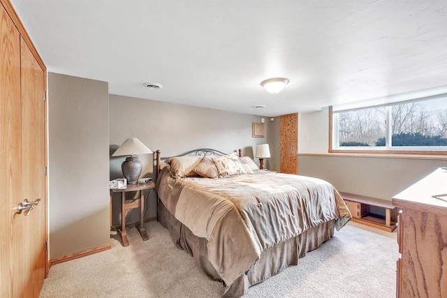 bedroom with light colored carpet