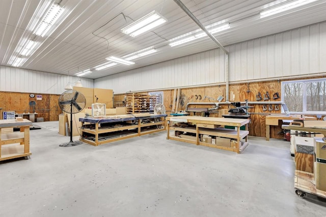 garage with metal wall and a workshop area