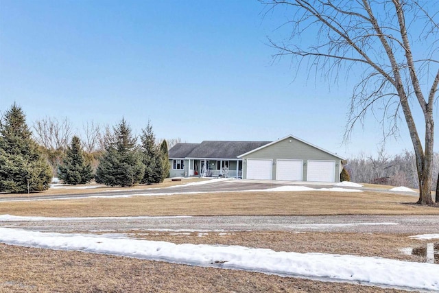 view of front of property with a garage and driveway