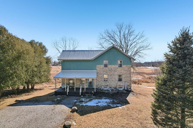 exterior space with covered porch and metal roof