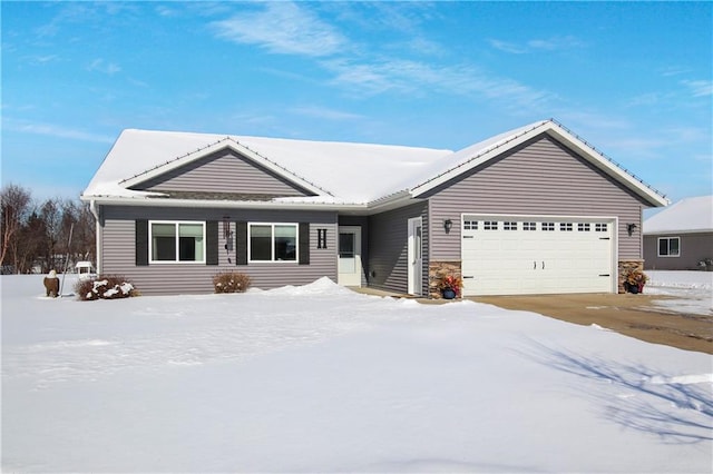 ranch-style home featuring a garage