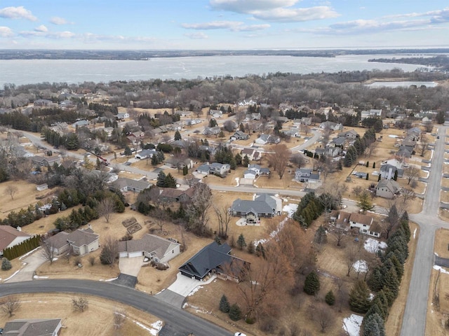 bird's eye view featuring a water view and a residential view