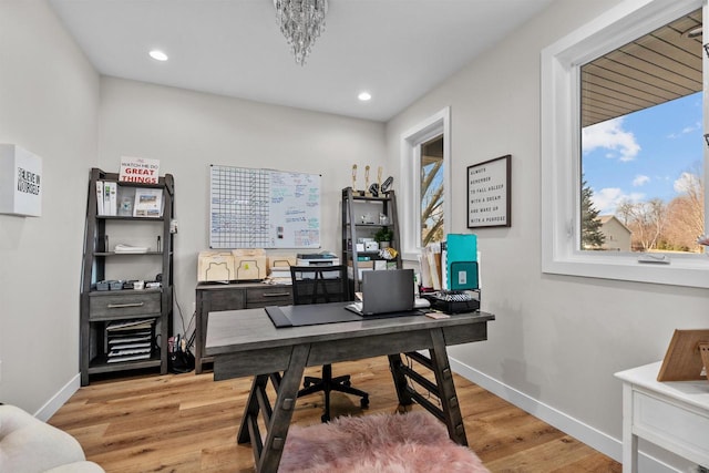 office space with recessed lighting, light wood-style flooring, and baseboards