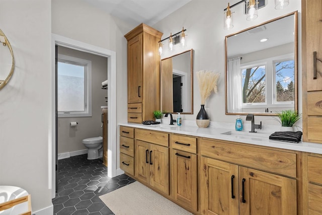 full bath featuring double vanity, visible vents, toilet, tile patterned flooring, and a sink