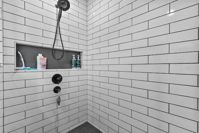 bathroom featuring a tile shower