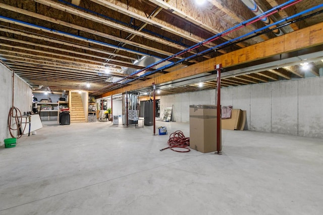 unfinished basement with water heater