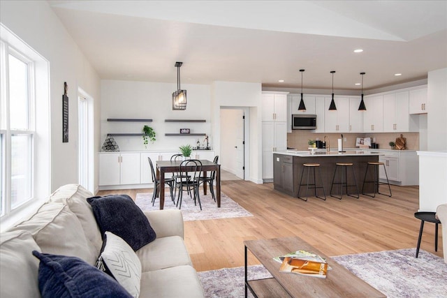 living room featuring recessed lighting and light wood-style floors