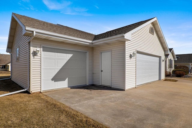 garage featuring driveway